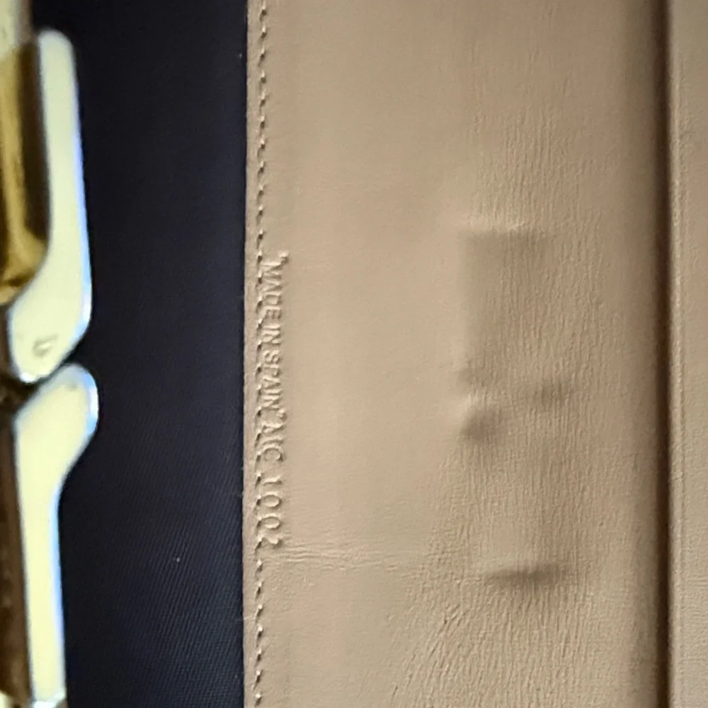 Dior Tan and Brown Monogram Wallet with snap clip close pouch.